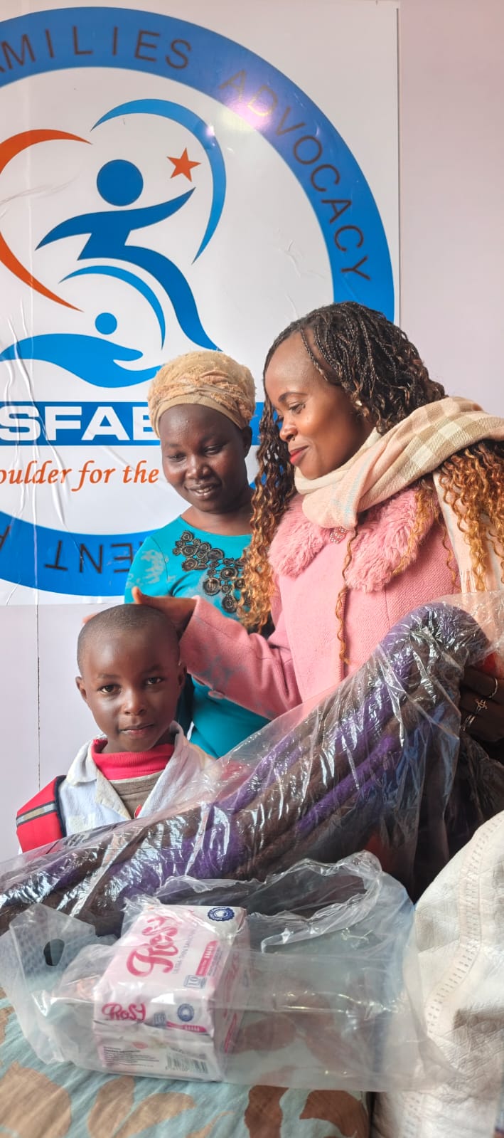 A vulnerable household receives donations at SFAEP office